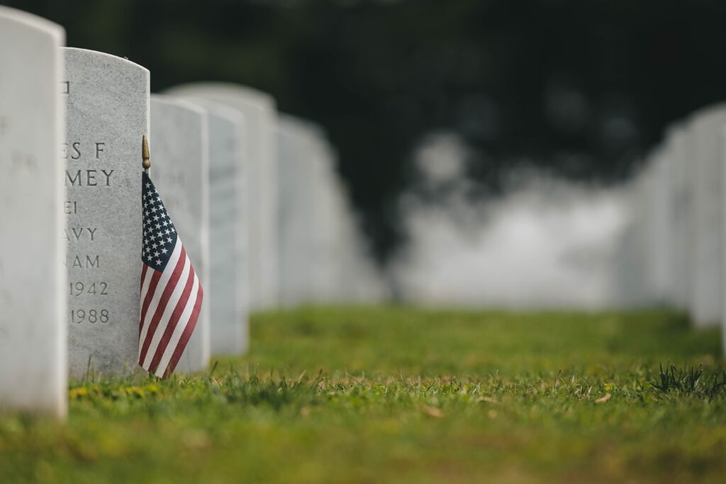 American flag next to headstones